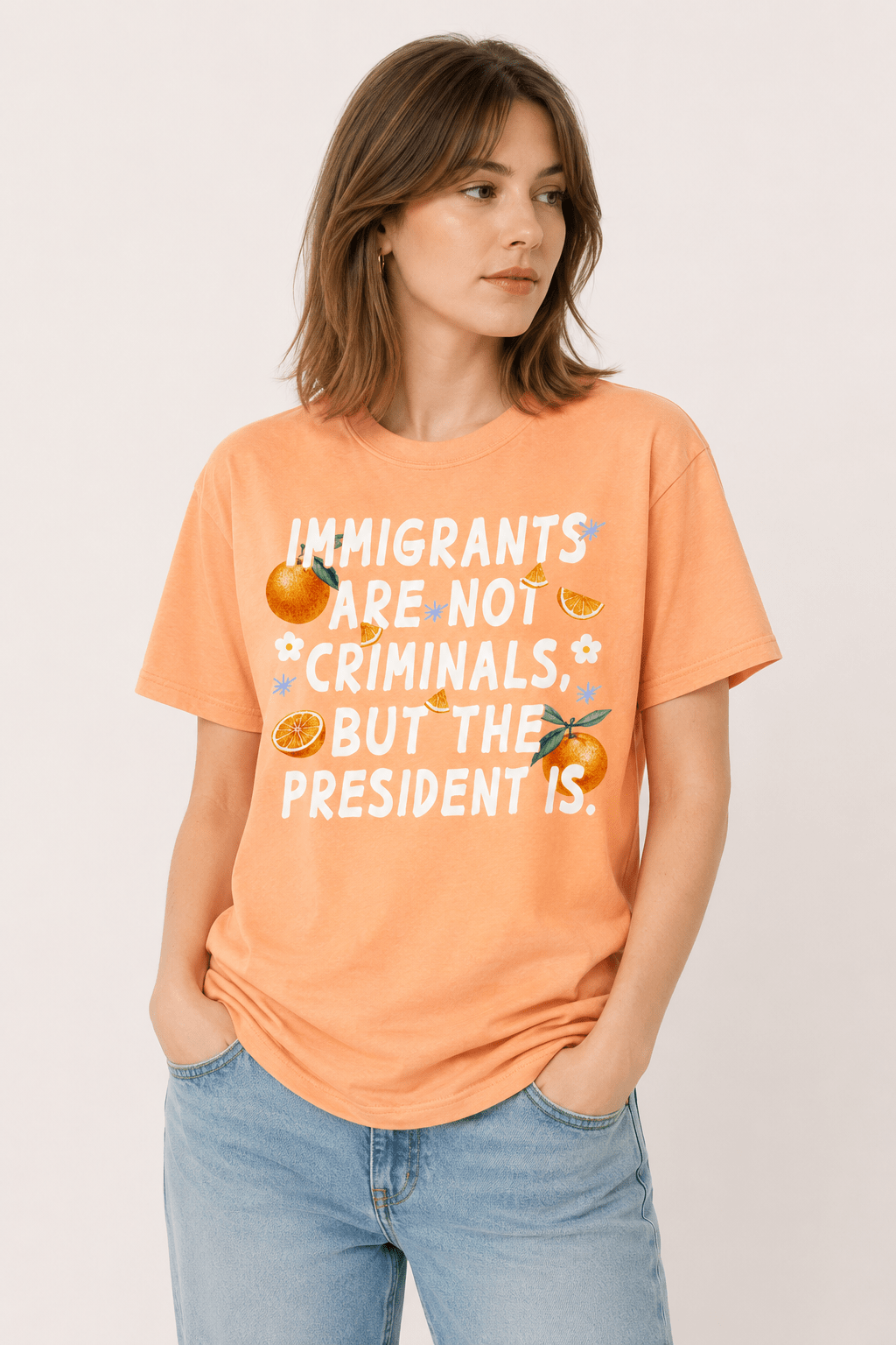 Immigrants Are Not Illegal But The President Is Tee - Hands Off United